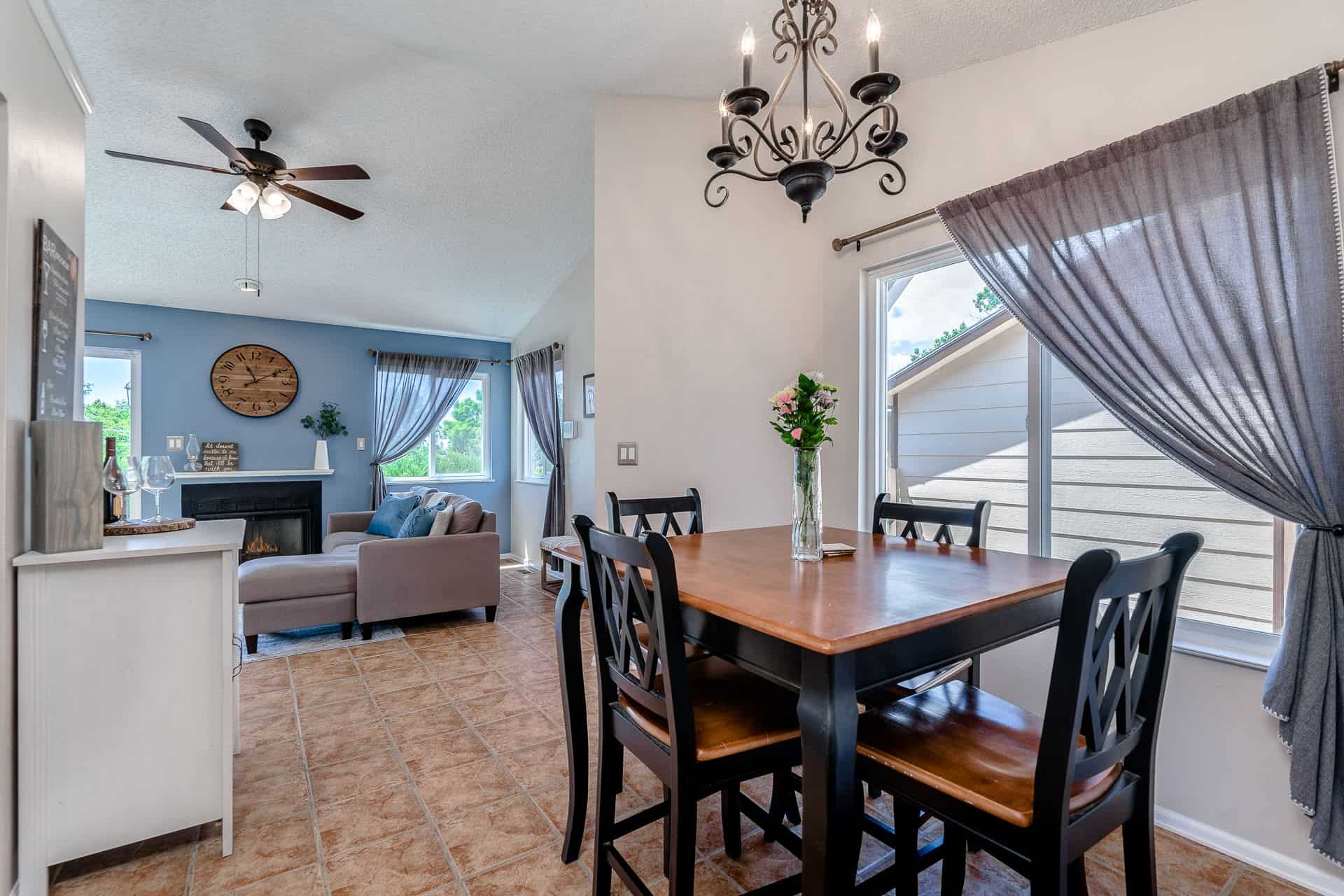 Dining Area located off the the Living Room and Kitchen and has an attractive light fixture and large window that brings in lots of natural light