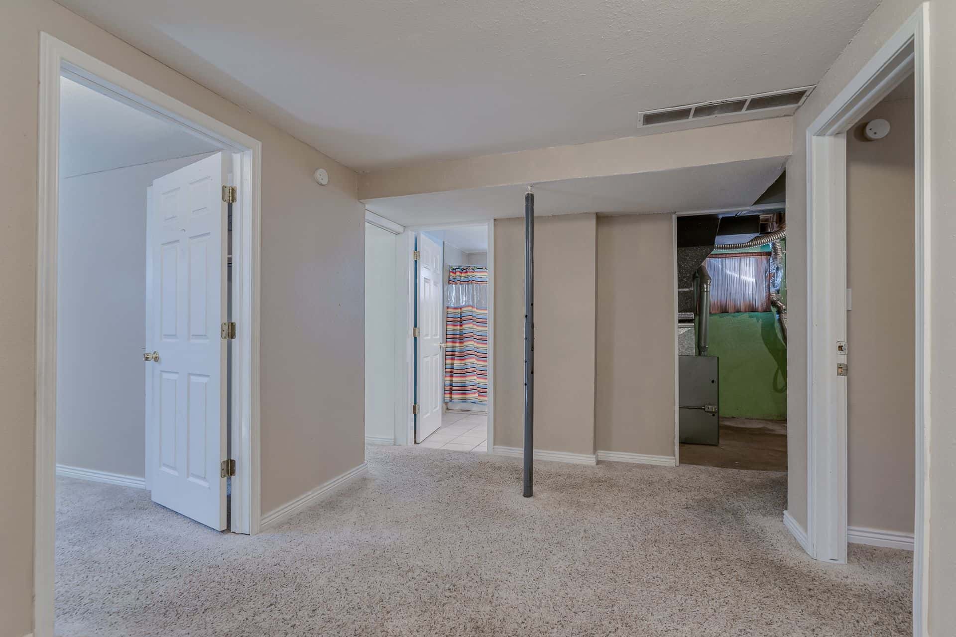 Basement Family Room into Basement Bedrooms and Mechanical/Laundry Room