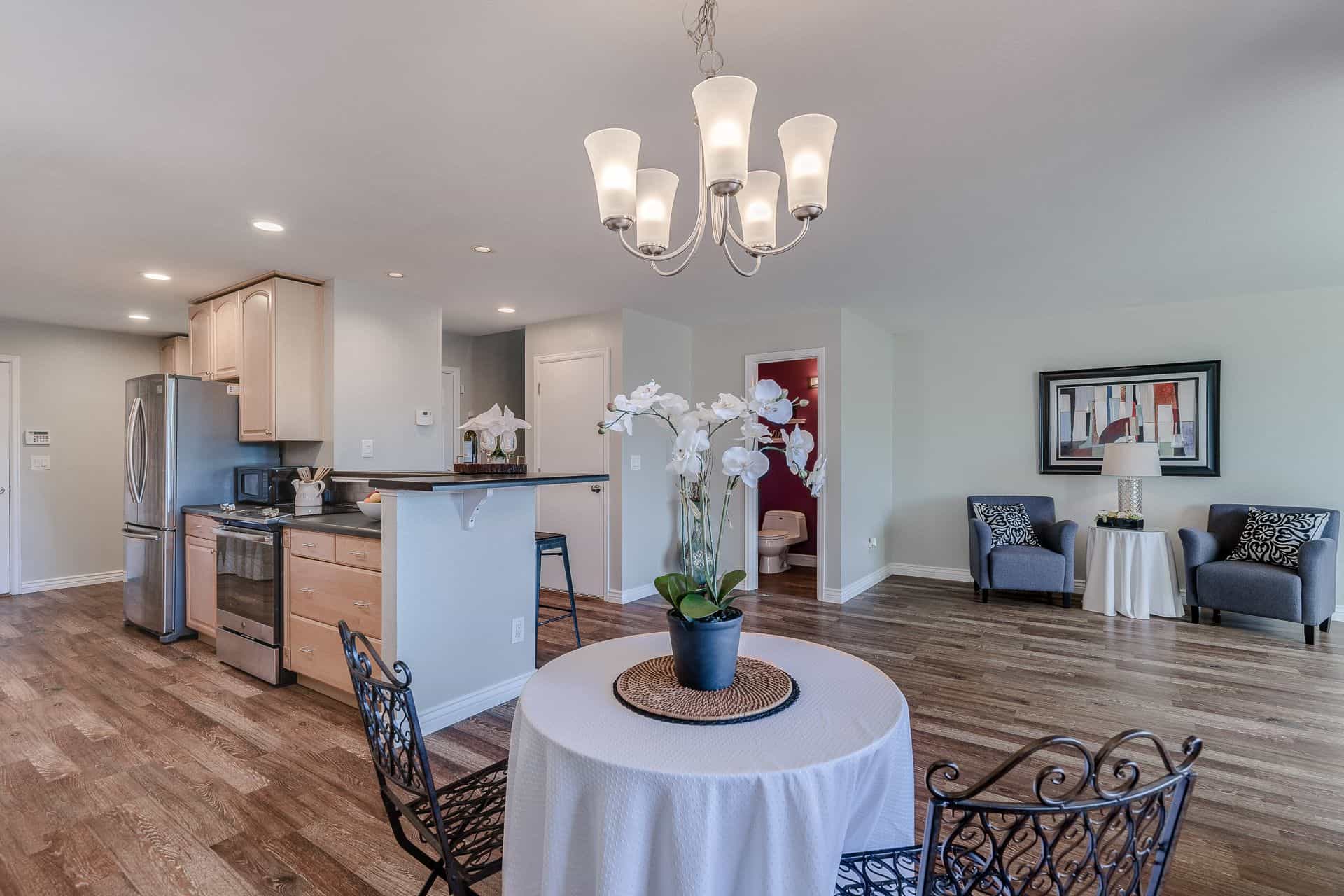 View of the Kitchen, Great Rm and Powder Bath from the Dining Area