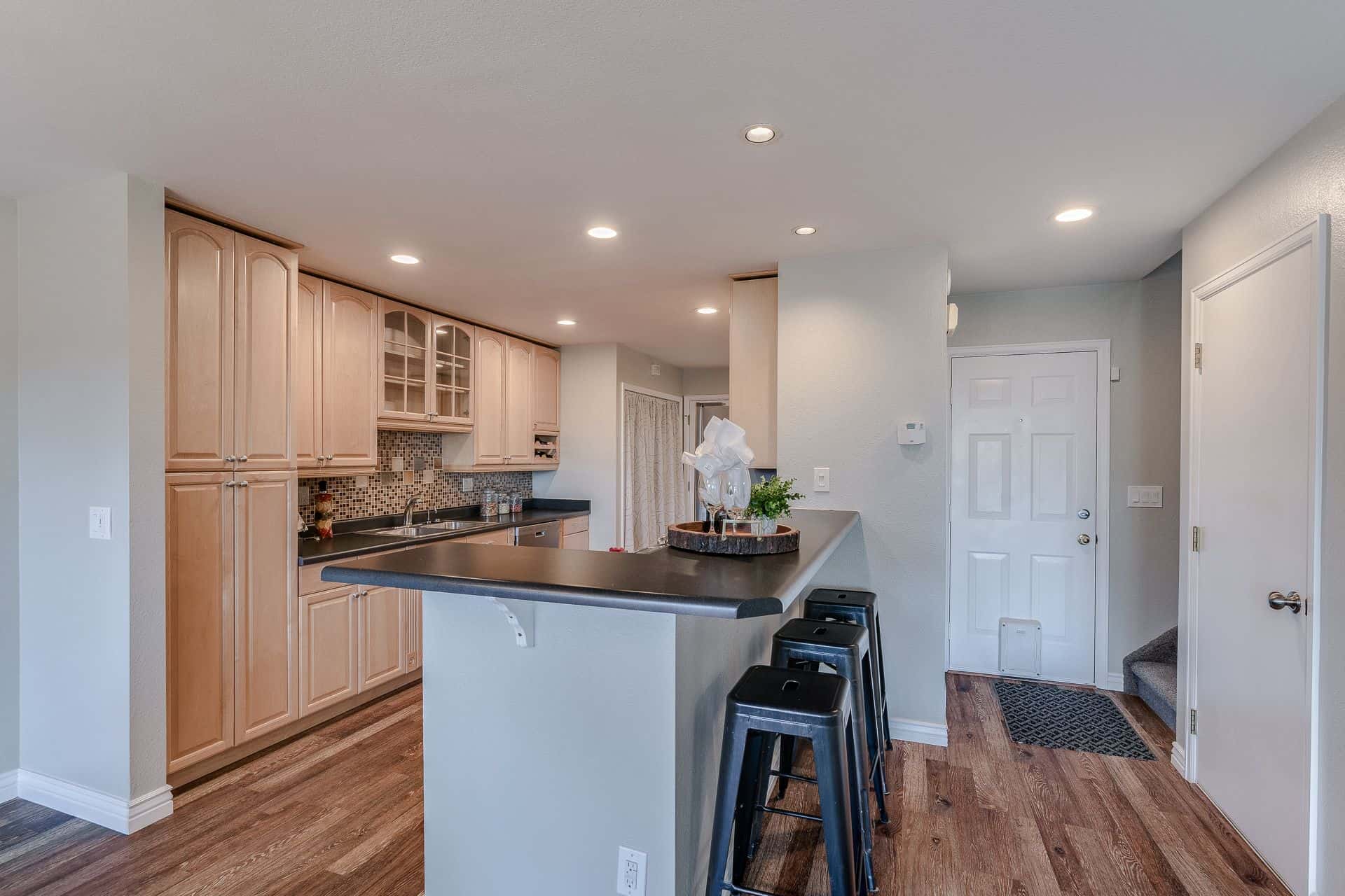 Entry into Remodeled Kitchen and Stairs to the Upper Level