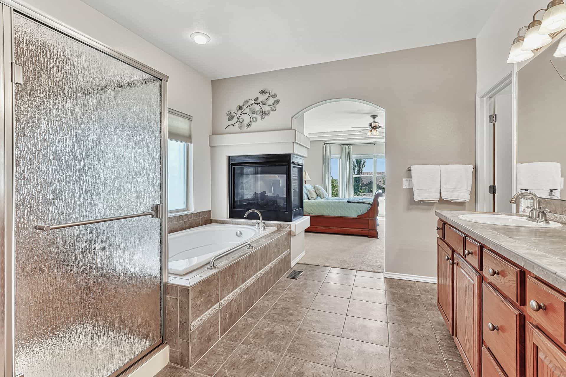 Primary Master Bathroom with Pedestal Fireplace