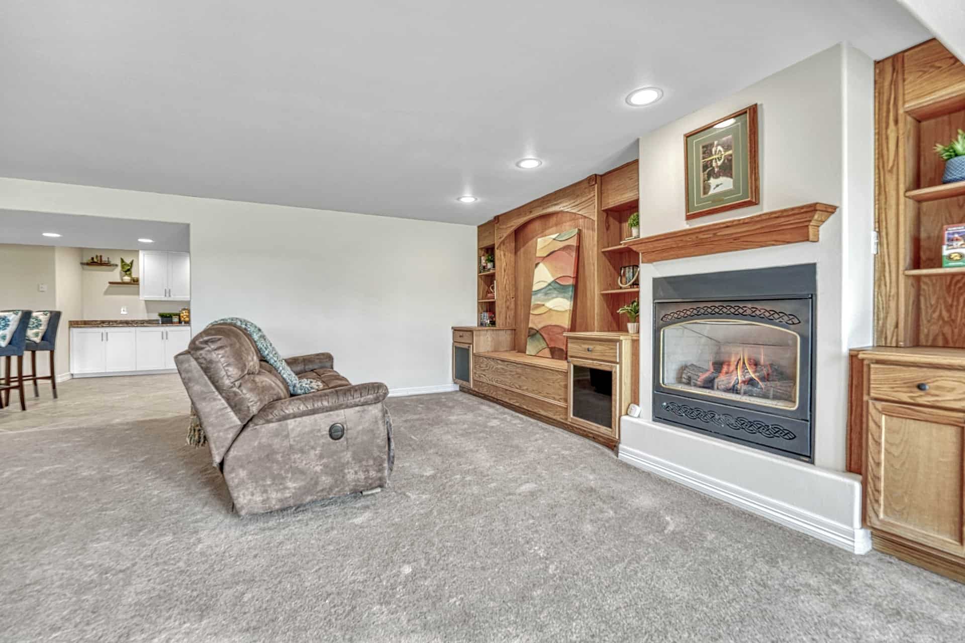 Basement TV Area with Built In Enterainment Center and Gas Log Fireplace