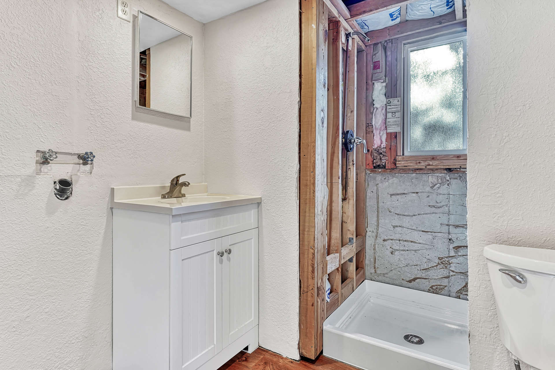 Powder Bathroom with Pre-Plumb for Shower